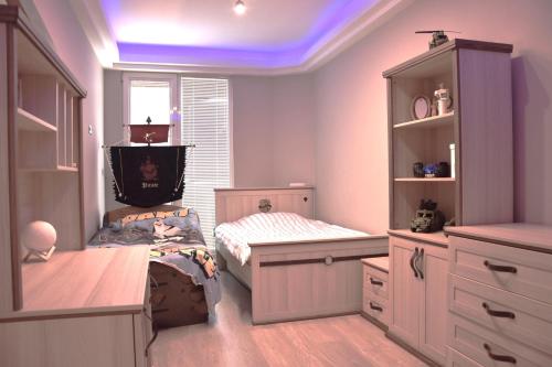 a childs bedroom with a bed and a window at Luxury apartment in Skopje in Skopje