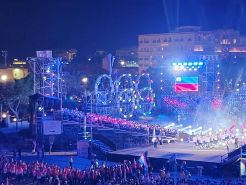 a crowd of people standing around a stage at night at Near Valletta City - Open Views - Ta Tessie Suite in Floriana - Malta in Il-Furjana