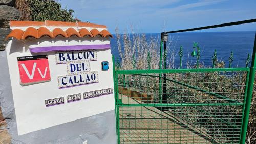 a sign that says balmoral del calidad next to a gate at Los Cerrajones: spectacular views from the cliff in Agulo