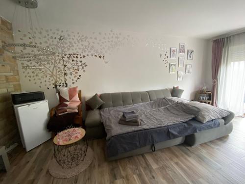 a bedroom with a bed and a couch and a table at Bochum ich komm aus Dir! in Bochum