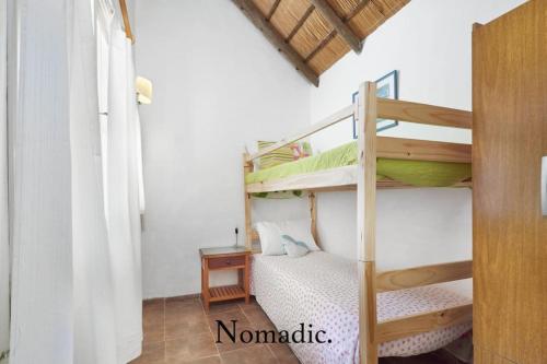Двухъярусная кровать или двухъярусные кровати в номере Casa en Punta del Este, Rincón del indio.