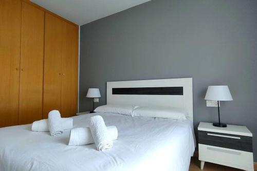 Ένα ή περισσότερα κρεβάτια σε δωμάτιο στο MAGNIFICO APARTAMENTO · PLAYA CANET DE BERENGUER