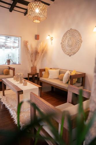 a living room with a couch and a table at HOSTAL CRUZ CHICA in La Cumbre