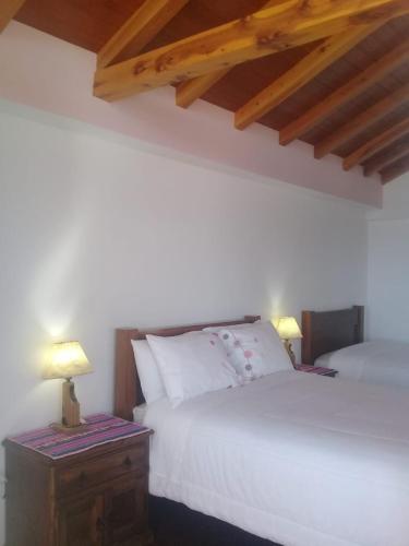 מיטה או מיטות בחדר ב-Casa Andina - Isla del Sol-Bolivia