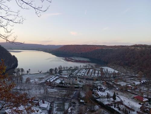 an aerial view of a city and a lake at La p'tite maison bois du hérisson in Ménétrux-en-Joux