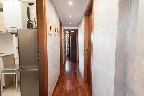 a hallway of a home with wooden floors at Apartment Forum IV in Assago