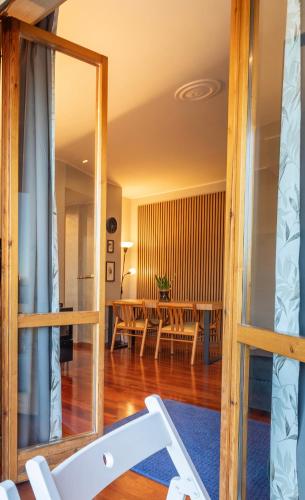 a view from the living room into the dining room at Apartment Forum IV in Assago