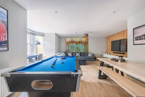 a living room with a pool table and a couch at Immaculate 3 Bed Apartment with Private Entrance in Inverleith in Edinburgh