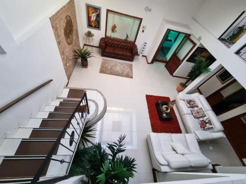 an overhead view of a living room with a spiral staircase at Florentina in Tunja