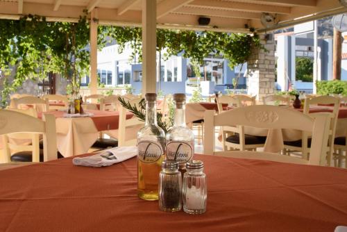 a table with two bottles of honey on a red table cloth at Matina Pefkos Aparthotel in Pefki Rhodes