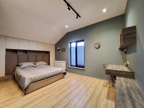 a bedroom with a large bed and a window at Lady and Bear GH in Sǝrdakhar