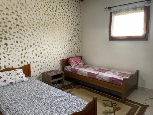Katil atau katil-katil dalam bilik di Villa Olympus