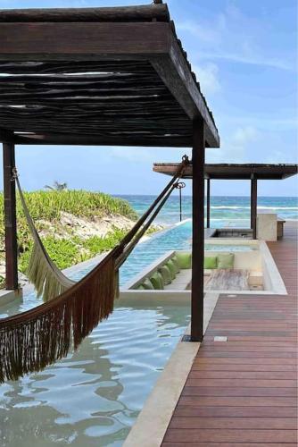 Jungle retreat with 2 pools & private beach access