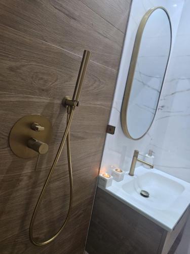 a bathroom with a sink and a mirror at Villa Naya et sa Piscine chauffée sans vis-à-vis in Agadir