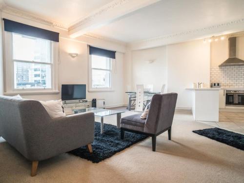 a living room with a couch and a table at U Suites on Manners in Wellington