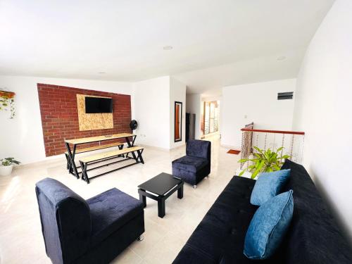 a living room with a couch and chairs and a table at Apartamento101 in Roldanillo