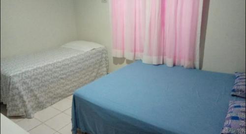 Krevet ili kreveti u jedinici u okviru objekta Casa com piscina em área nobre