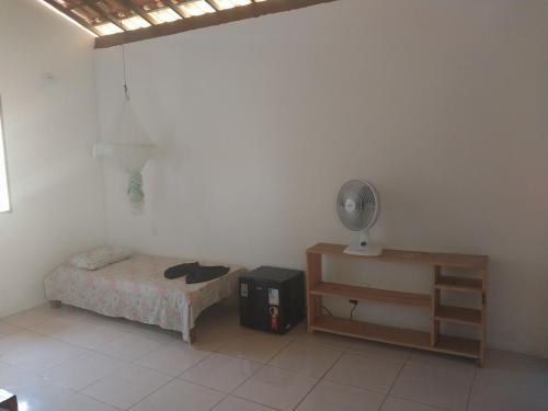 Giường trong phòng chung tại Sem Fronteiras