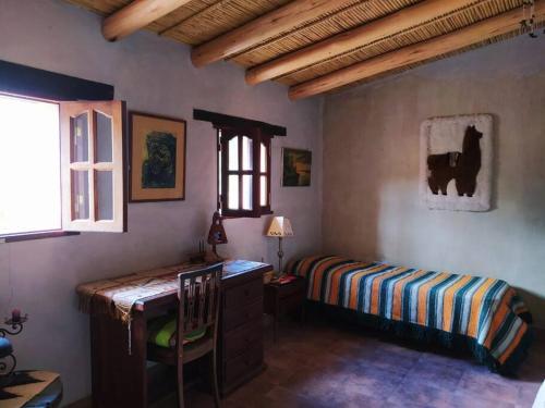 מיטה או מיטות בחדר ב-La Casa de Tilcara
