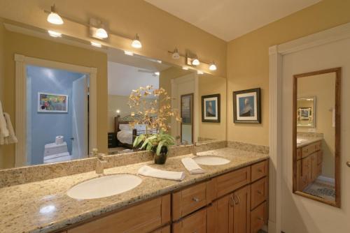 a bathroom with two sinks and a large mirror at Gorgeous! Nicest Part of San Jose, Almaden in San Jose