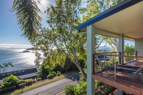 a house with a view of the water at Compass Point on Hamilton Island by HIHA in Hamilton Island