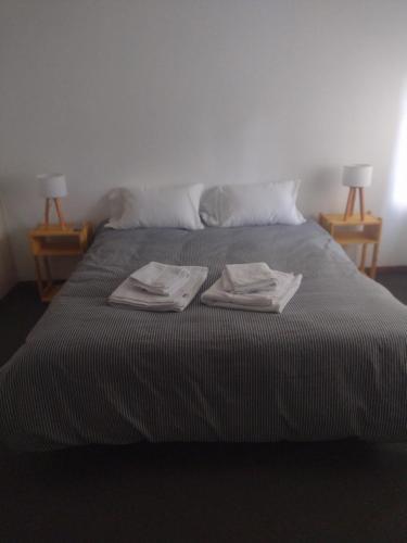 Кровать или кровати в номере Dpto Residencial