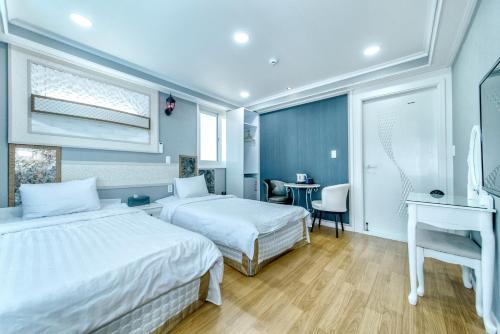 Ένα ή περισσότερα κρεβάτια σε δωμάτιο στο Mulddeule Shimpang Resort