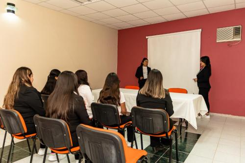a group of women sitting around a table in a room at HOTEL DEL VALLE INN IXMIQUILPAN in Ixmiquilpan