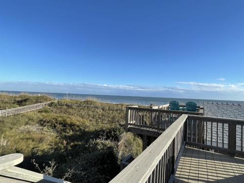 a boardwalk leading to the beach and the ocean at 39 ALMOST HEAVEN condo in Hatteras