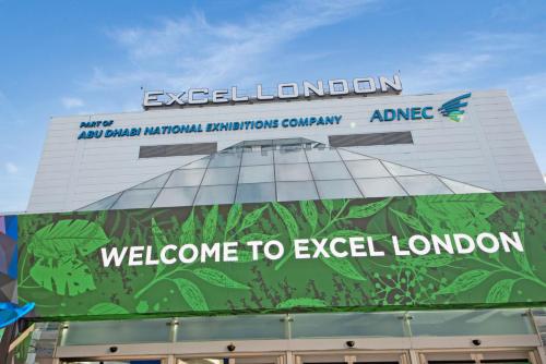 a building with a welcome to excel london sign on it at Excel 3 Bedroom Apartment Near City Airport and O2 Arena in London