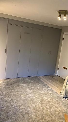 an empty room with white cabinets and a ceiling at Southampton centre - 1 bed studio flat in Southampton