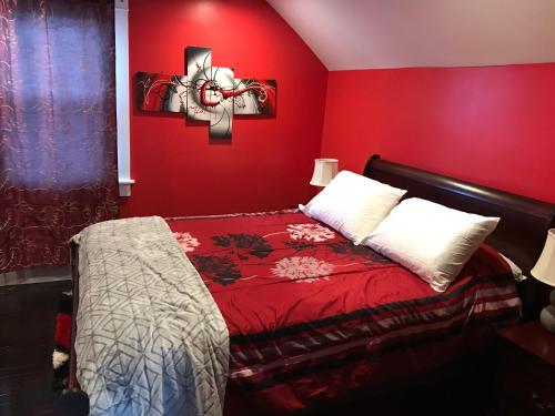 a red bedroom with a bed with a red wall at Mount Pleasant Hideaway in Providence
