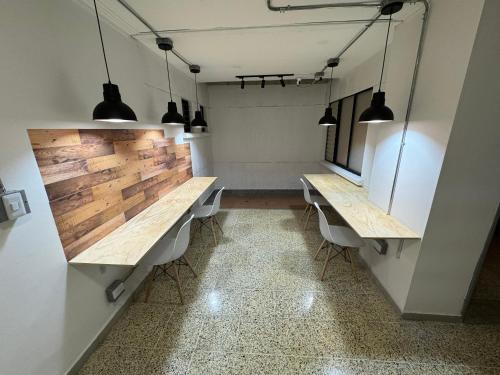 a room with two tables and two chairs at Rustik House in Medellín