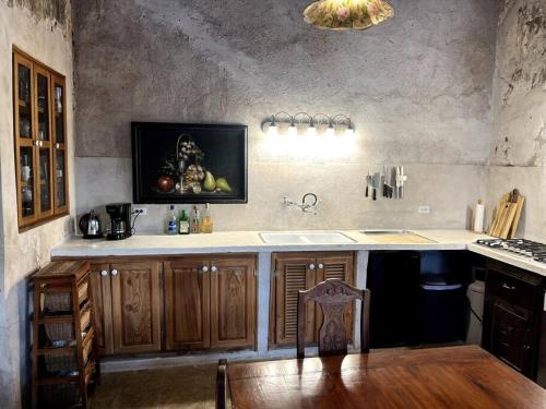 a kitchen with a sink and a counter top at Casa de Flaco in Álamos