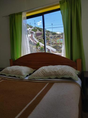 מיטה או מיטות בחדר ב-Posada de la Luna