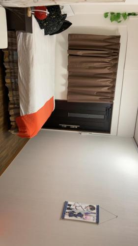 Katil atau katil-katil dalam bilik di Yoshidoku Inn Domemae 1 - Close to USJ World Expo Airport吉徳家庭旅館1ドーム前近万博USJ空庭菓匠温泉大阪城公园难波心斋桥関西空港直达免费寄存旅行箱