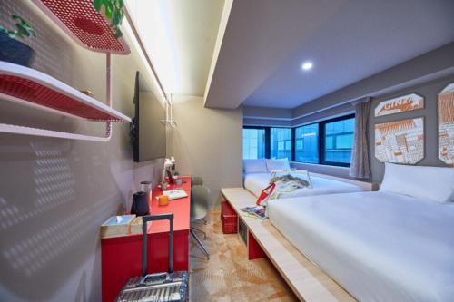 a small room with a bed and a desk at lyf Ginza Tokyo in Tokyo