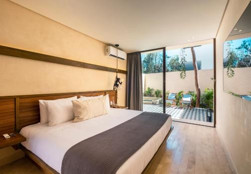 Postel nebo postele na pokoji v ubytování Faisano Boutique Hotel by Cruz Hoteles