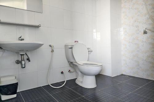 a bathroom with a toilet and a sink at ONE Residence in Pathum Thani