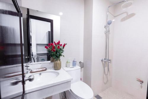 a bathroom with a toilet and a sink and a shower at Hanoi Cozy Legend Hotel in Hanoi