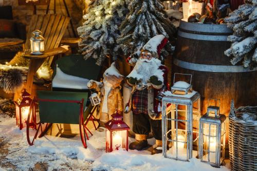 a christmas display with a santa clause and lights at Apartmany pod Pustevnami in Prostřední Bečva