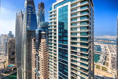 a view of a tall building in a city at The Torch, Dubai Marina in Dubai
