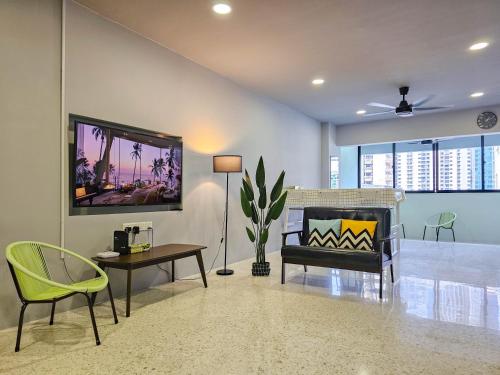 a living room with a couch and a table at Stay429 at Bukit Bintang 4bedroom 15pax By Shine Stay in Kuala Lumpur
