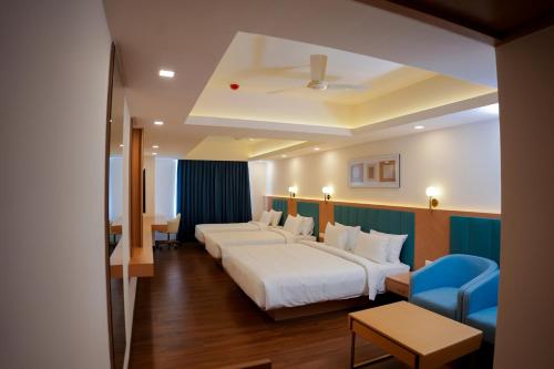 Postel nebo postele na pokoji v ubytování Hotel Turmeric