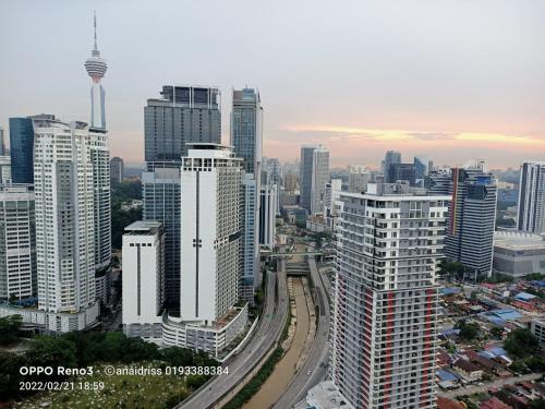 an aerial view of a city with tall buildings at Legasi Kampung Baru guest house by rumahrehat in Kuala Lumpur