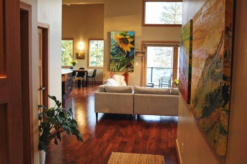 a living room with a couch and a table at Five Star-Amazing views and Hot Tub in Crescent Valley