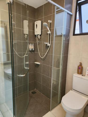 a bathroom with a shower with a toilet at SY@Tiara Homestay in Bangi