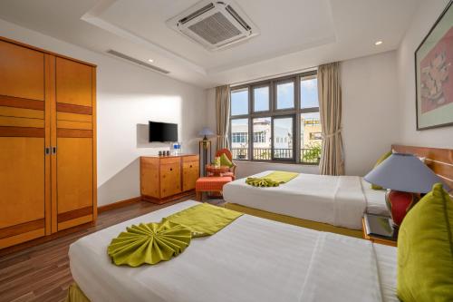 Letto o letti in una camera di Richico Apartments And Hotel