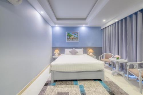 a hospital room with a bed and a table at Ocean Pearl Hotel Phu Quoc in Phu Quoc