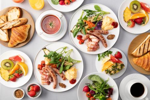 a bunch of plates of food on a table at The Royal Park Hotel Iconic Nagoya in Nagoya